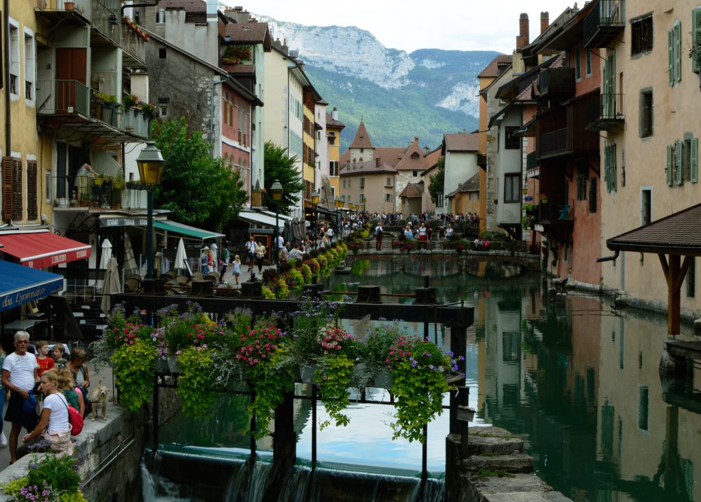 Annecy Canal lined with shops and restaurants