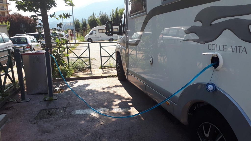 Filling up with water in the motorhome aire, Susa, Italy