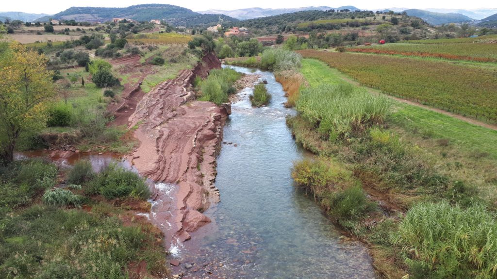 Red rock alongside a canal in Cartels, France