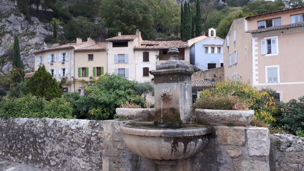 Moustiers St Marie Fountain and pastel painted houses