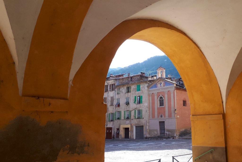 Looking out across the square from under the church archways