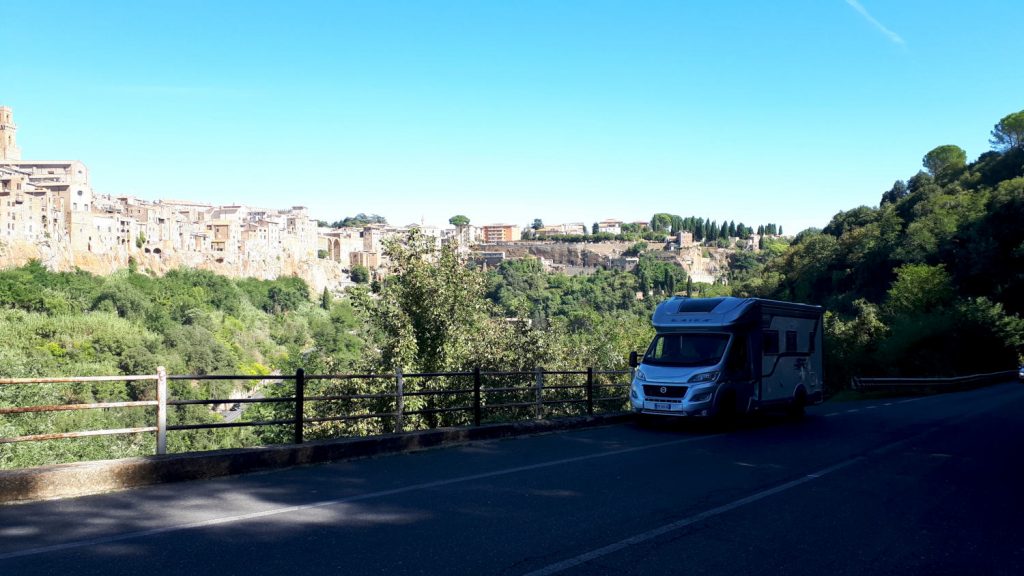 Buzz parked on the roadside overlooking the Pitigliano skyline