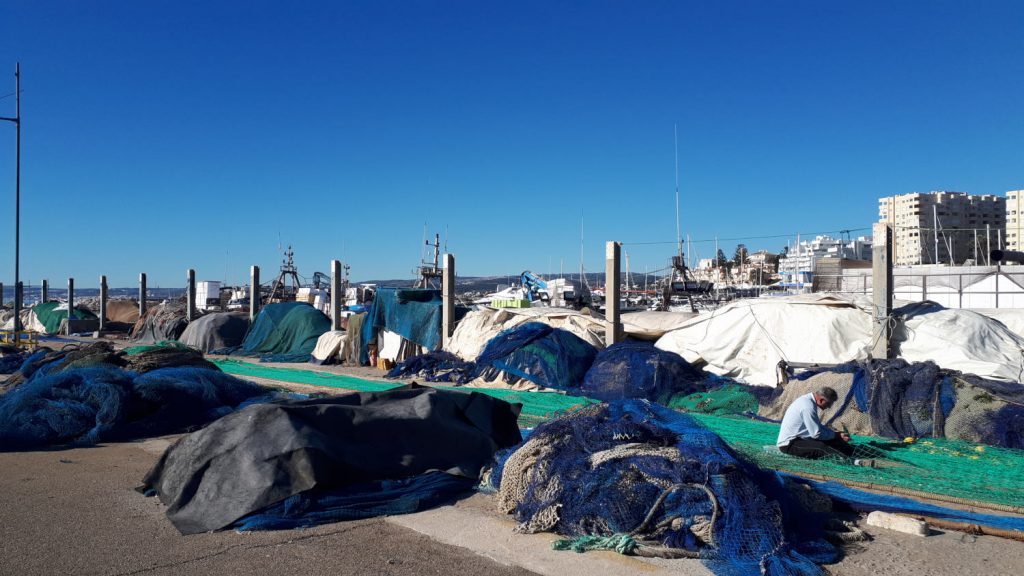 Marina at Estepona mending fishing nets