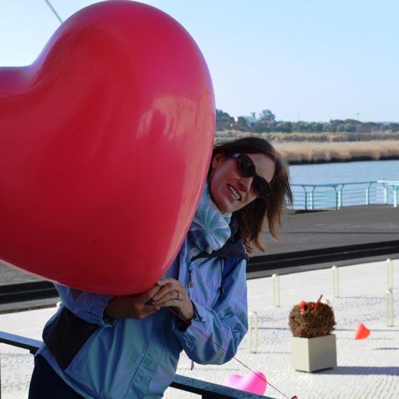 Trying not to get blown away with a giant heart shaped balloons at Alcacer do Sal