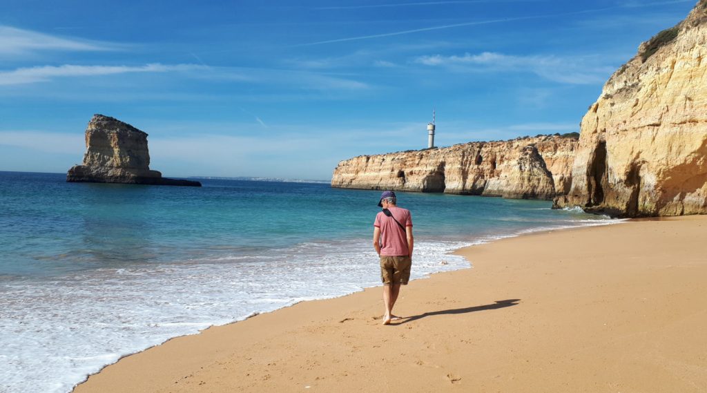 A stroll along the beach cove at Caneiros, Algarve