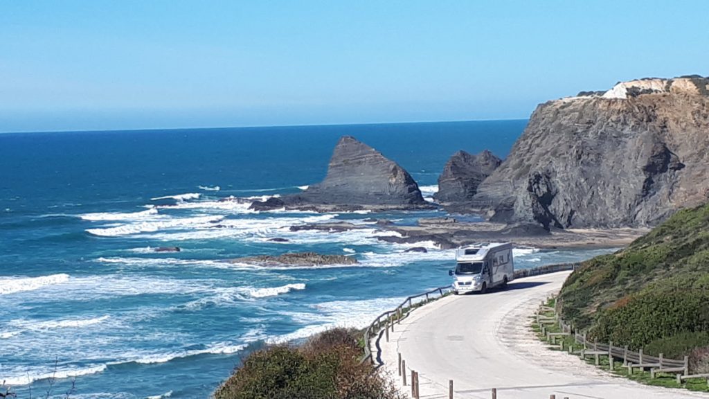 Buzz driving by the dramatic coastline of Praia da Odeceixe