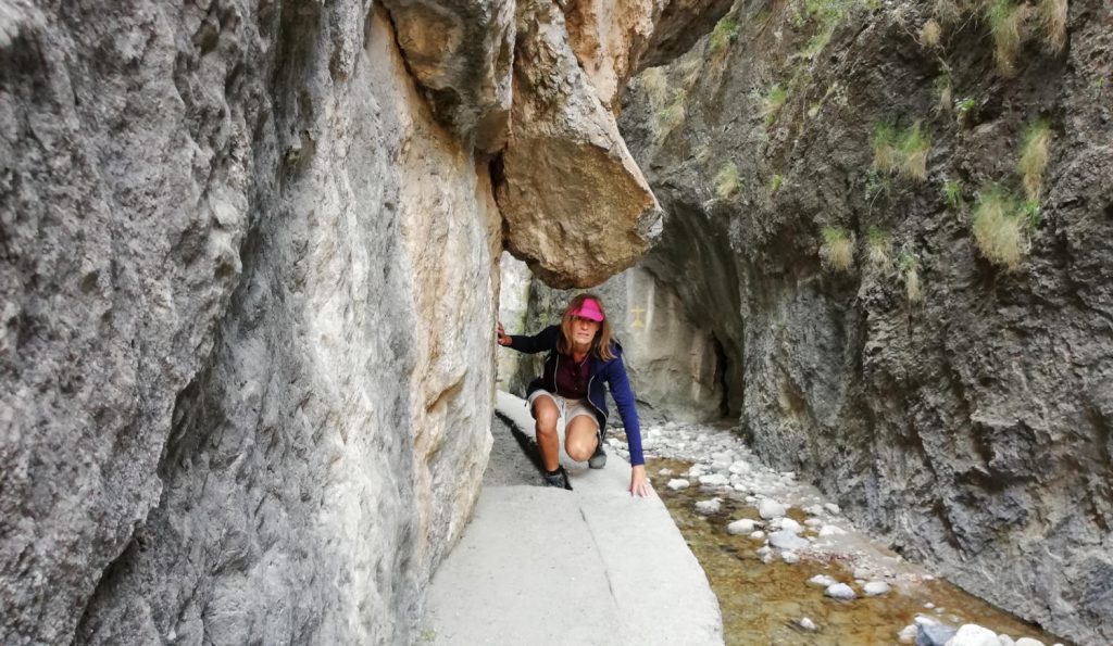 Narrow path with overhanging rocks