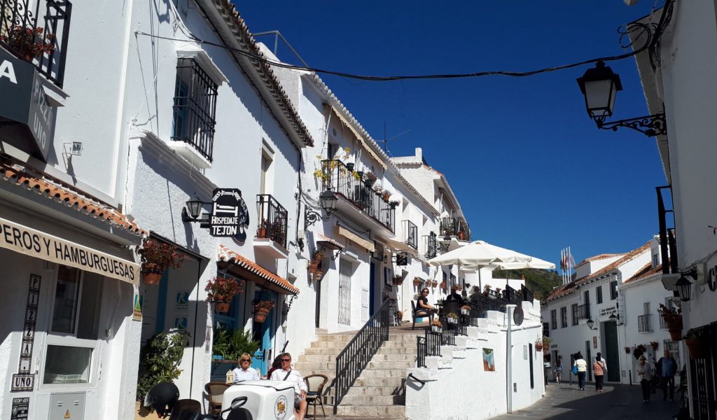 Mijas Pueblo street with terraced cafe