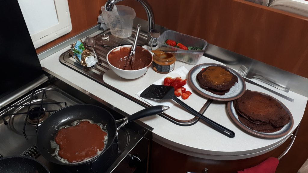 Making chocolate pancakes in the motorhome kitchen