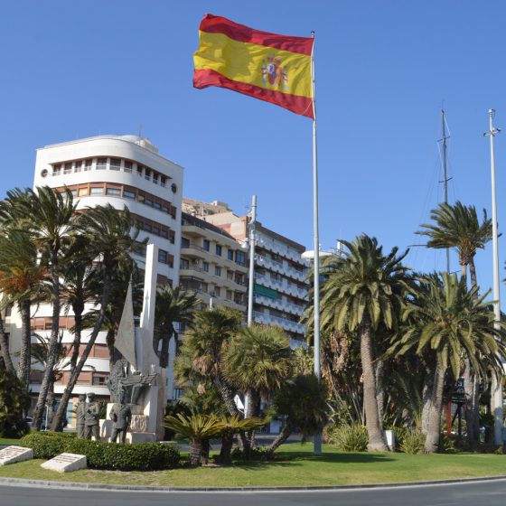 Alicante - Spanish flag bears up under the strong winds