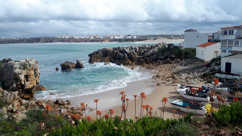 Small sheltered harbour with a few fishing boats