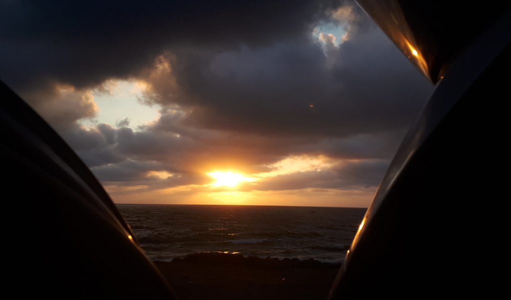 Watching the sunrise at the beach in Almeria