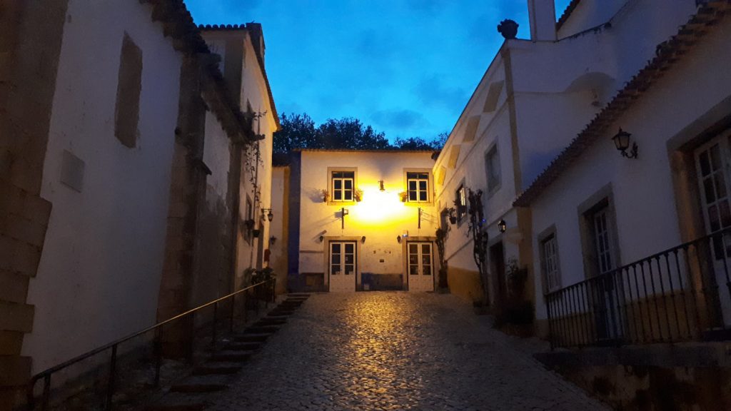 One of the narrow side streets of Obidos street at night