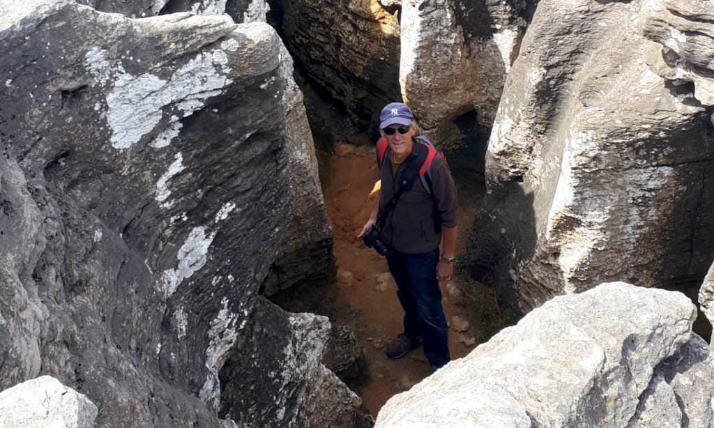 Down on the sand, exploring the crevices in the rocks