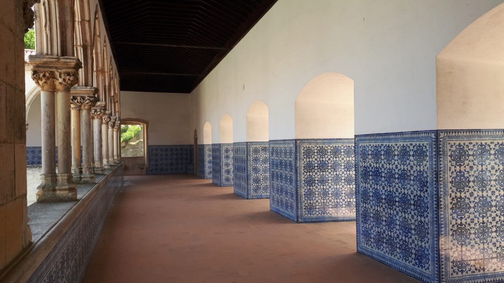 Blue and white tiled courtyard arcade