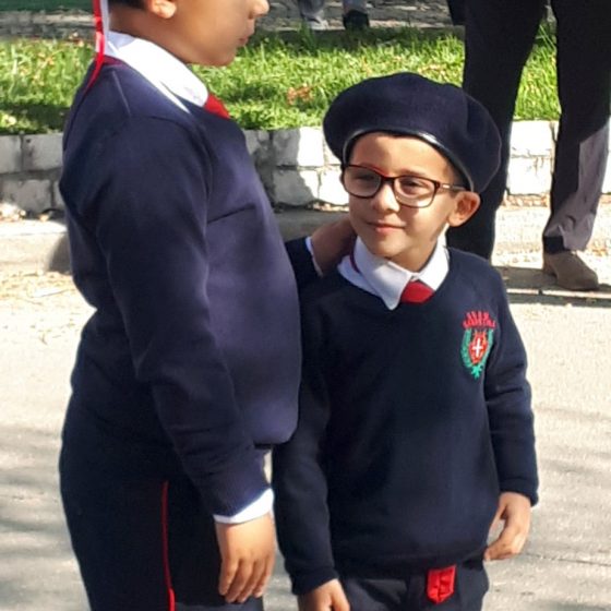 Two young boys preparing to start the procession