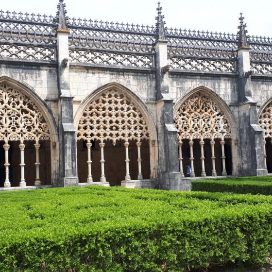 Elaborate stonework and the open courtyard at Batalha Monastery.
