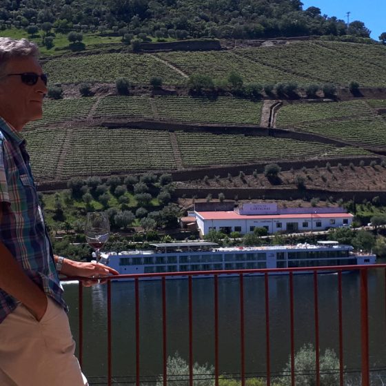 On the terrace at Quinta do BomFim as a river boat cruises by