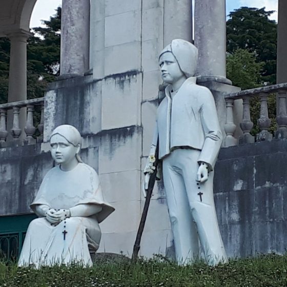 Two of the three shepherd children in statue form