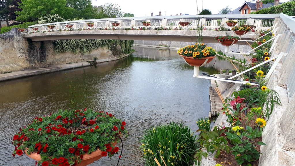 One of Vendome's many bridges decorated with colourful flower baskets