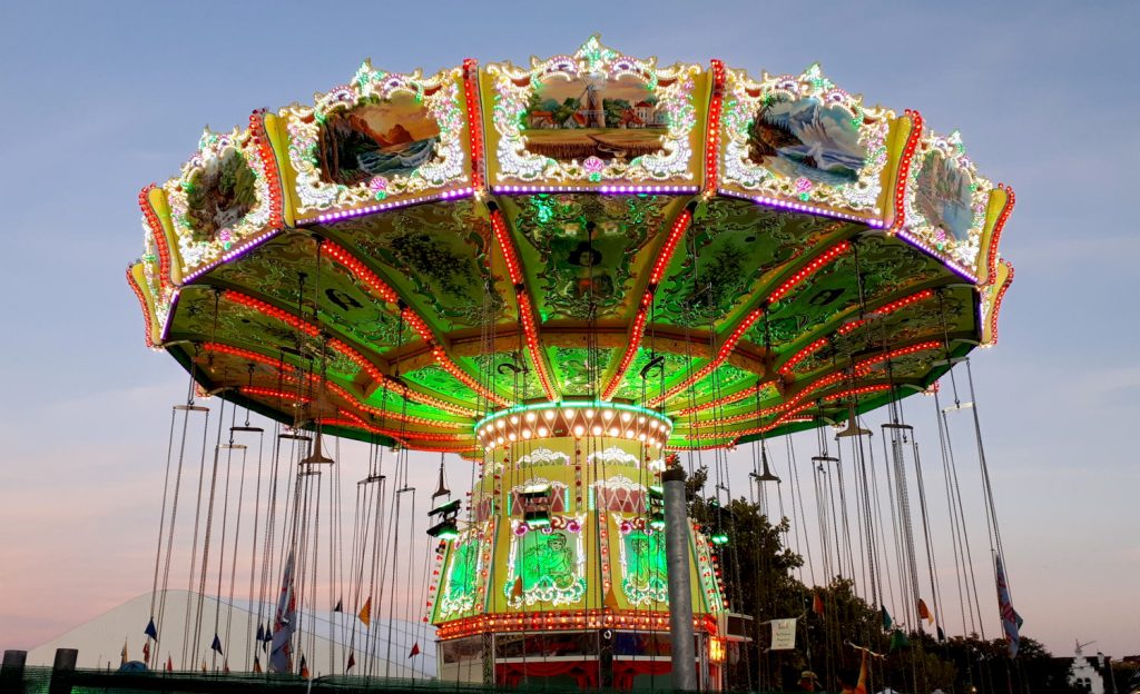 The colourful carousel at the entrance to the festival