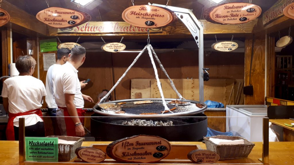 A huge sausage sizzling cooker