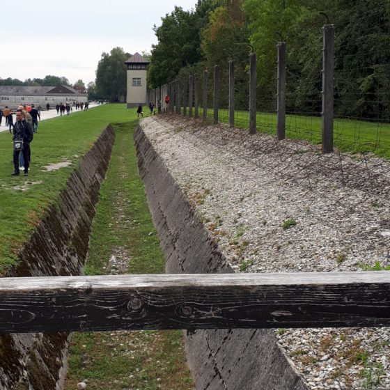 The perimeter with ditch and barbed wire fence. Prisoners would often delivery jump over in order to be shot - a blessed relief for some.