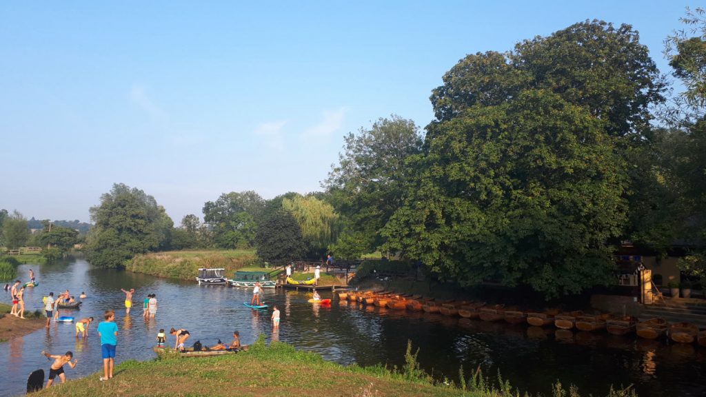 Families enjoying a dip in the Stour at Dedham