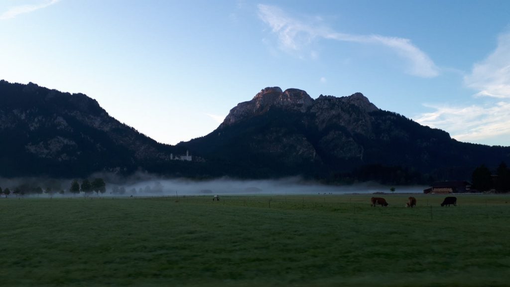 A ribbon of mist hanging over the ground below Neuschwanstein Castle