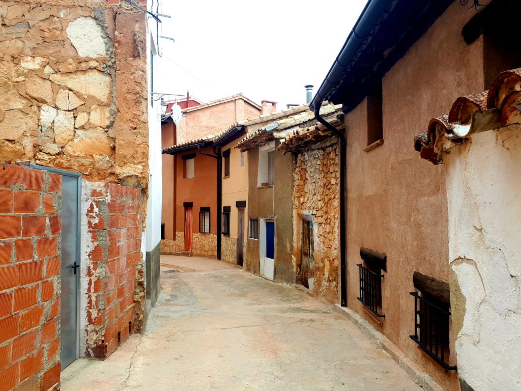 A typical street in Ademuz, half finished, never finished or abandoned in parts