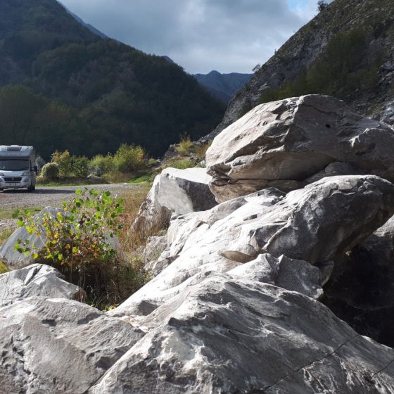 Buzz the motorhome dwarfed by giant marble rocks