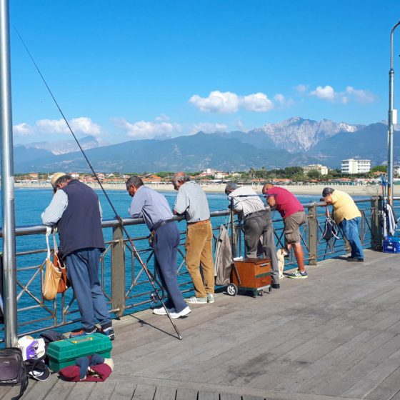 Eager fisherman on the pier