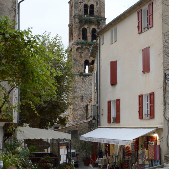 Moustiers Sainte-Marie stepped alleyway with climbing roses