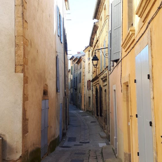 Typical narrow, painted street in Jouques historical town