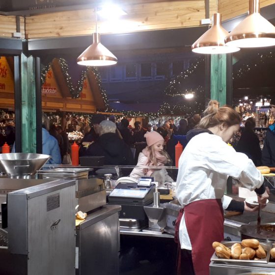 Busy food stall serving various types of 'wurst'