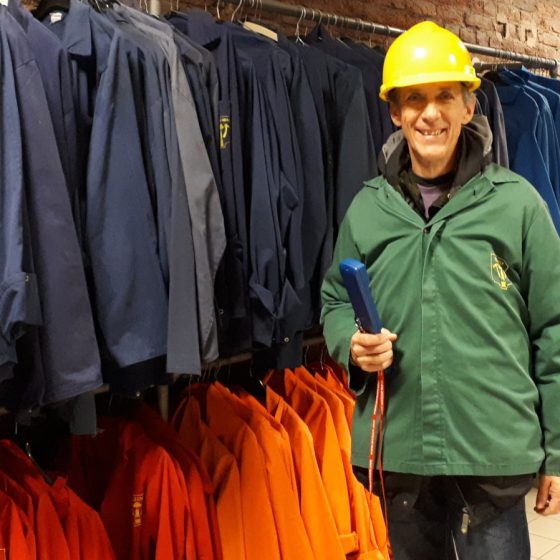 Kitted out in overall and hard hat for our trip down the mine