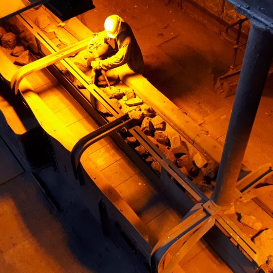 Sorting the coal from the rocks under sodium lighting