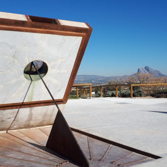 Sundial at the Antequera Dolmens visitor site with Lovers Leap in the background