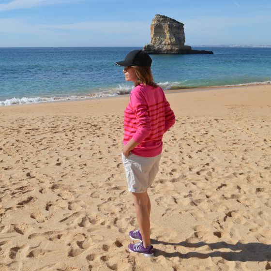 Gazing out to sea on the long sandy beach at Ferragudo