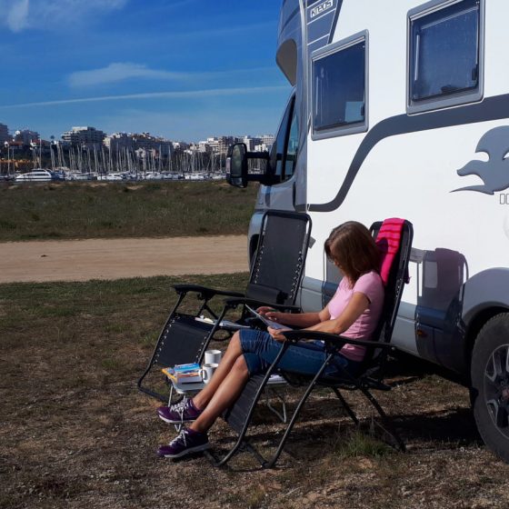 Checking the map while sitting out in the sun at Ferragudo