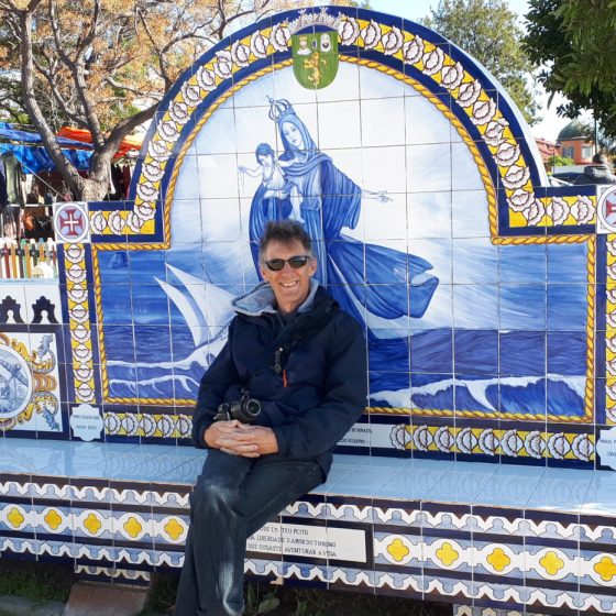 Taking a break on a traditionally tiled on a decorative seat in Olhau