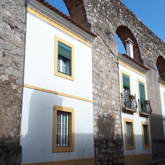 Evora houses built into the arches of the aqueduct