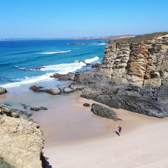 Waving up from the cove at Porto Covo