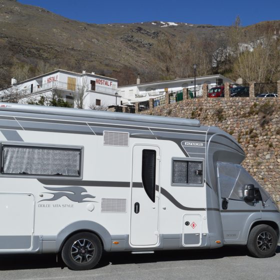 Trevelez - Buzz parked with snow on mountain behind