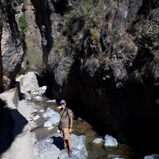 Park of the walk over the rocks in the shallow river