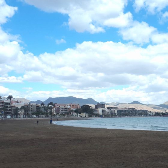 The curved sandy bay beach at Puerto del Mazarron