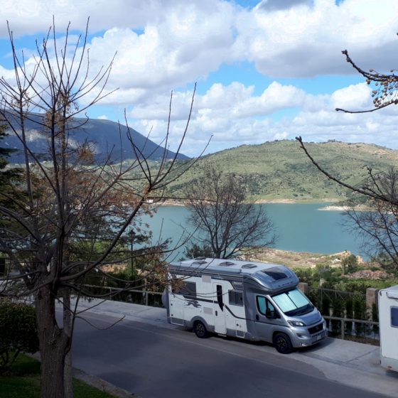 Buzz Laika parked with a view of the Zahara de la Sierra reservoir