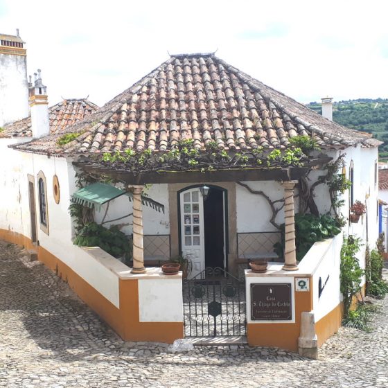 A quaint little guesthouse on a street corner in Obidos