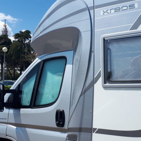 Buzz Laika in the motorhome parking area at Fatima with the shrine in the background