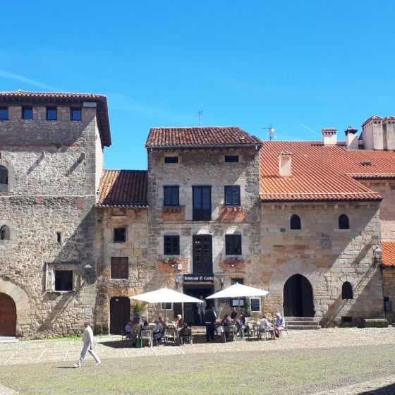 Warm coloured stone buildings and tiled roofs